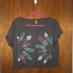 Feather headdress crop top.